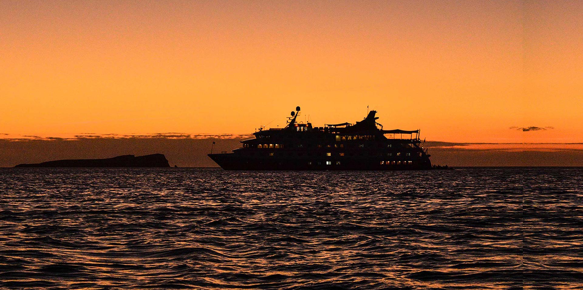 Santa Cruz II sailing in Galapagos at sunset