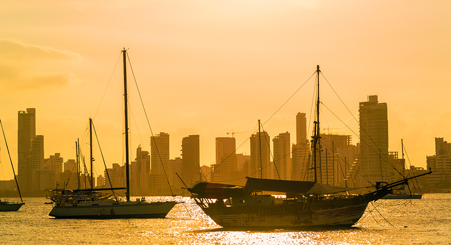 Boats and skyscrapers at sunset in Cartagena, Colombia