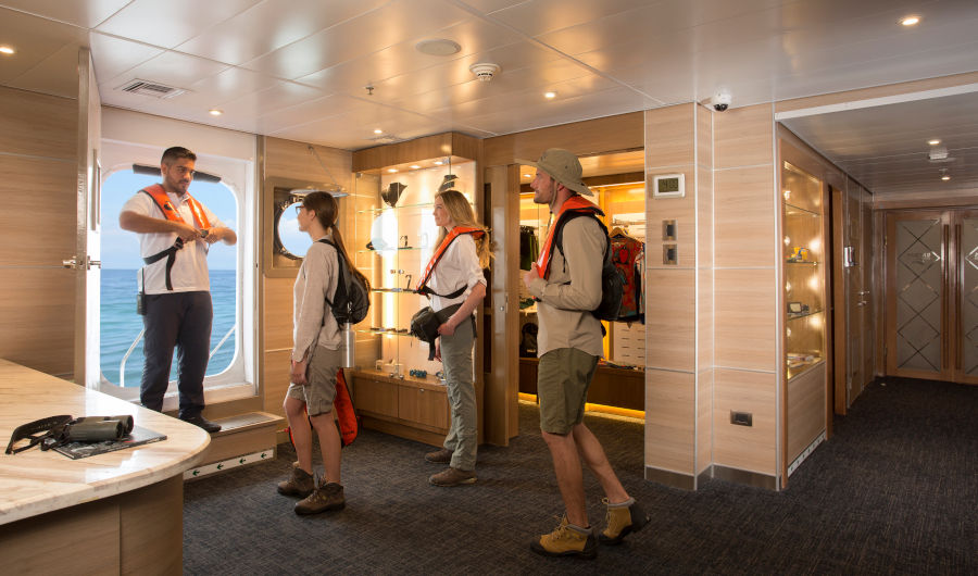Visitors chime in on safety instructions prior to an expedition into the Galapagos Islands