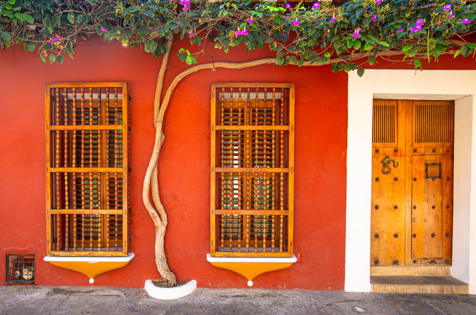 Cartagena's Walled City's colorful facades with topiary accents