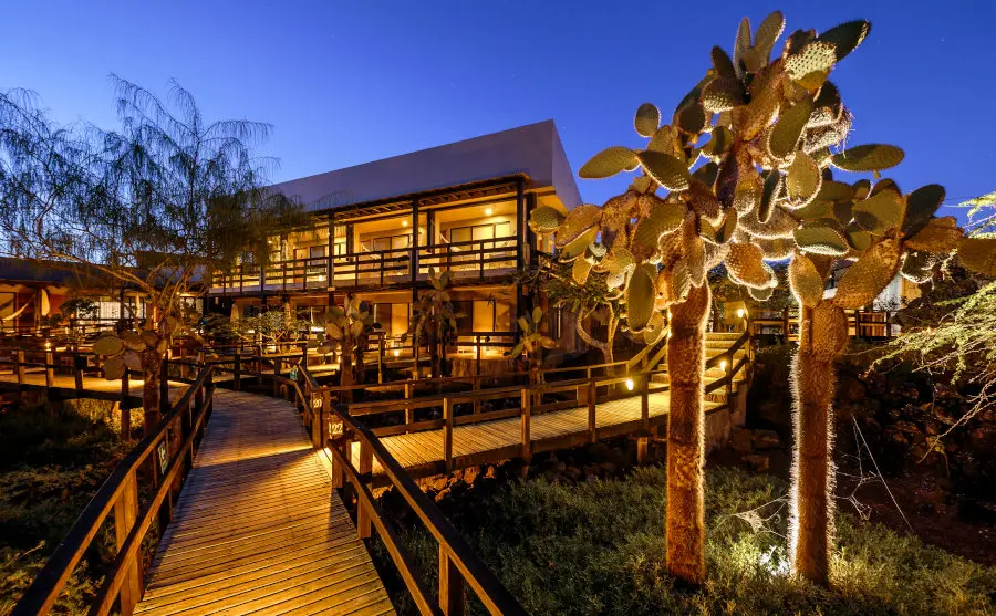Lights come on as night falls around Finch Bay Galapagos Hotel