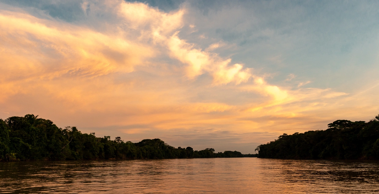 The Guayabero River in Colombia glows under a stunning sunset